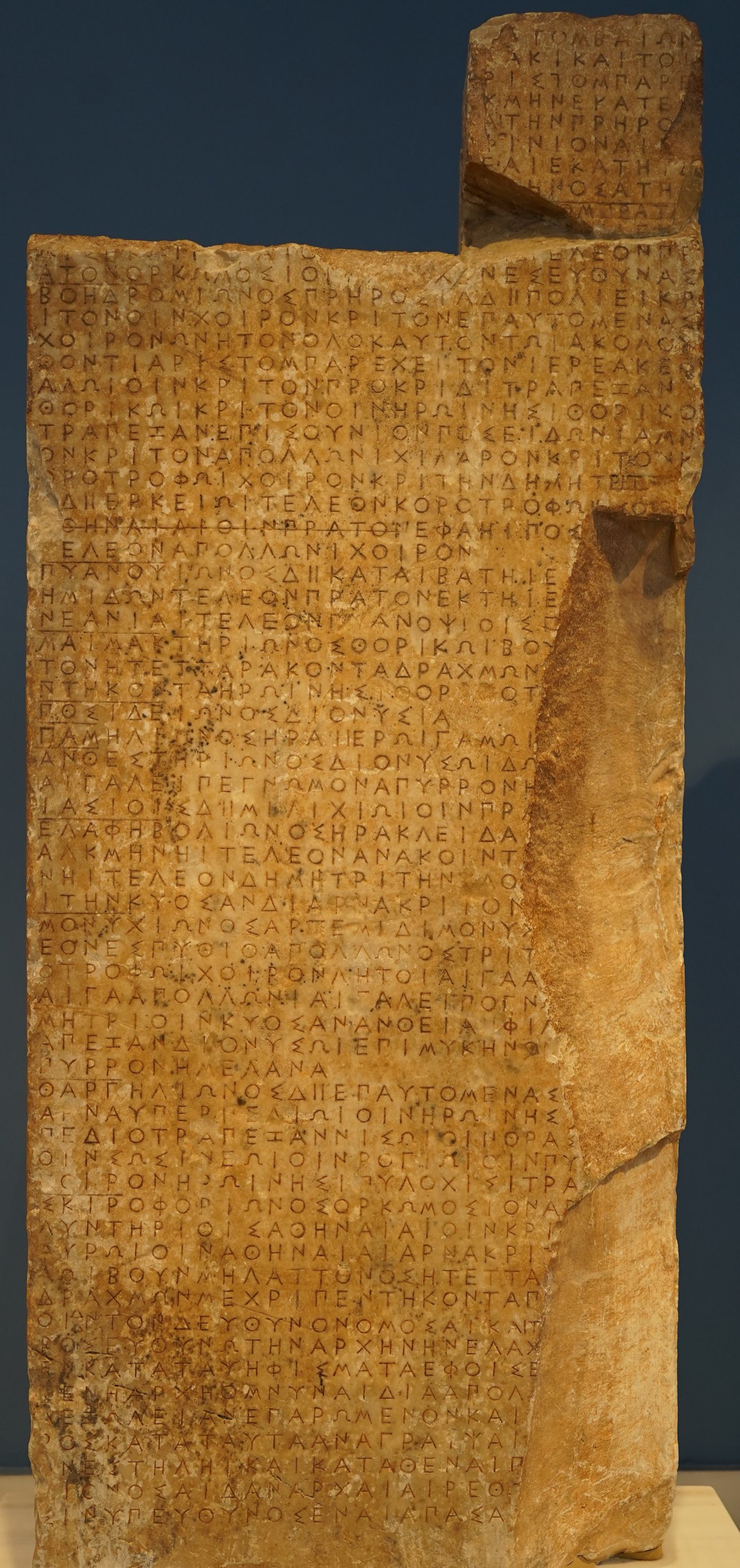 The Thorikos calendar stele in the Epigraphic Museum, Athens: two joined marble
fragments, the front face inscribed stoichedon with 65 lines